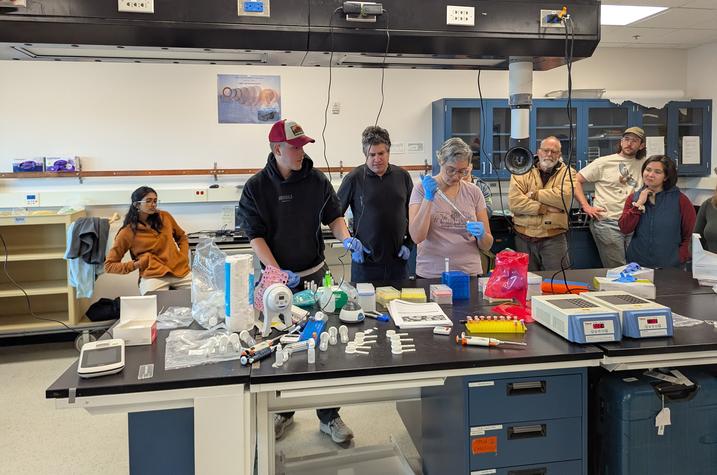 Berry, Bodin, and Anni Noble demonstrate the sampling process. Photo provided.